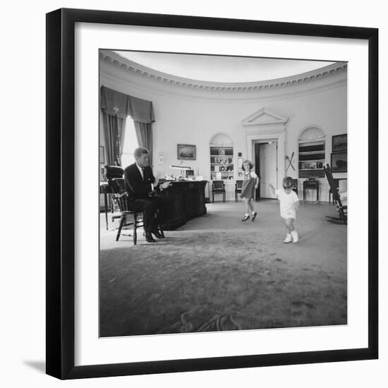 Caroline and John Jr. Dance in the Oval Office as President Kennedy Claps. 1962-null-Framed Photo