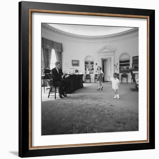 Caroline and John Jr. Dance in the Oval Office as President Kennedy Claps. 1962-null-Framed Photo