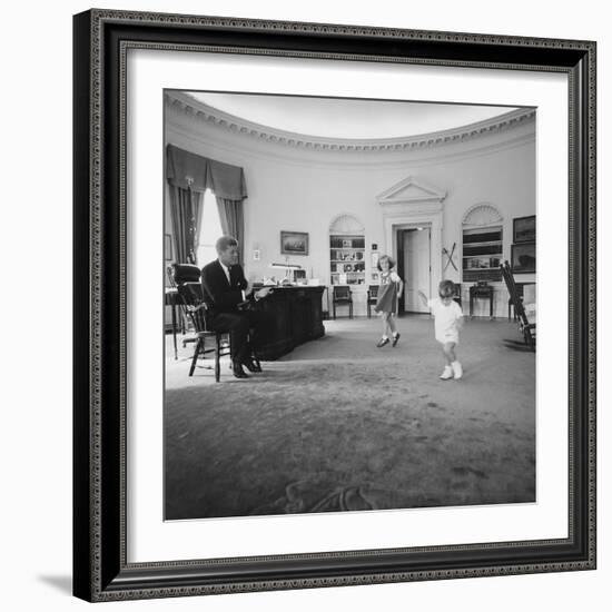 Caroline and John Jr. Dance in the Oval Office as President Kennedy Claps. 1962-null-Framed Photo