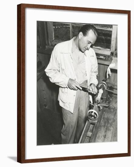 Carpenter at Work in His Woodshop-null-Framed Photo