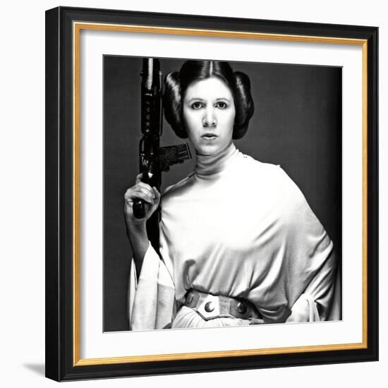 CARRIE FISHER. "Star Wars: Episode IV-A New Hope" [1977], directed by GEORGE LUCAS.-null-Framed Photographic Print