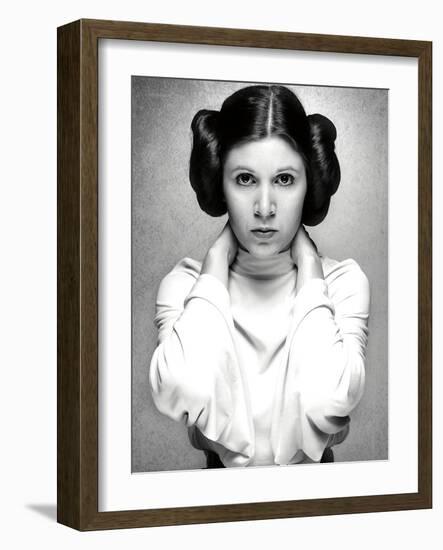 CARRIE FISHER. "Star Wars: Episode IV-A New Hope" [1977], directed by GEORGE LUCAS.-null-Framed Photographic Print