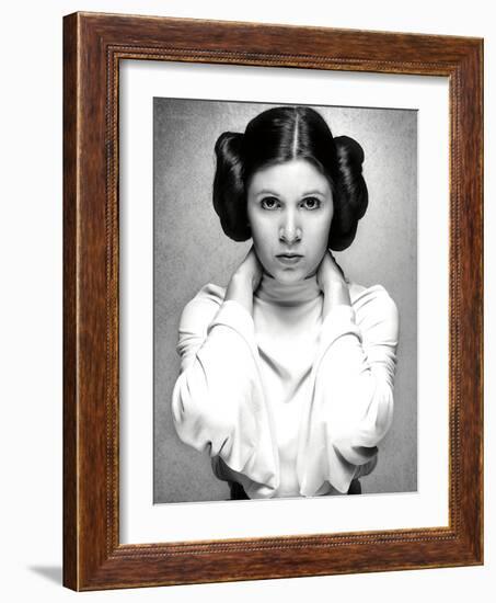 CARRIE FISHER. "Star Wars: Episode IV-A New Hope" [1977], directed by GEORGE LUCAS.-null-Framed Photographic Print