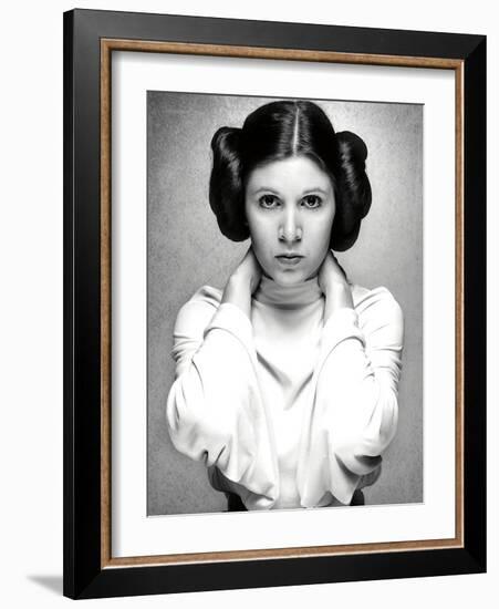 CARRIE FISHER. "Star Wars: Episode IV-A New Hope" [1977], directed by GEORGE LUCAS.-null-Framed Photographic Print