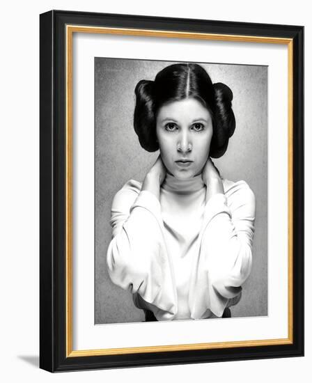 CARRIE FISHER. "Star Wars: Episode IV-A New Hope" [1977], directed by GEORGE LUCAS.-null-Framed Photographic Print