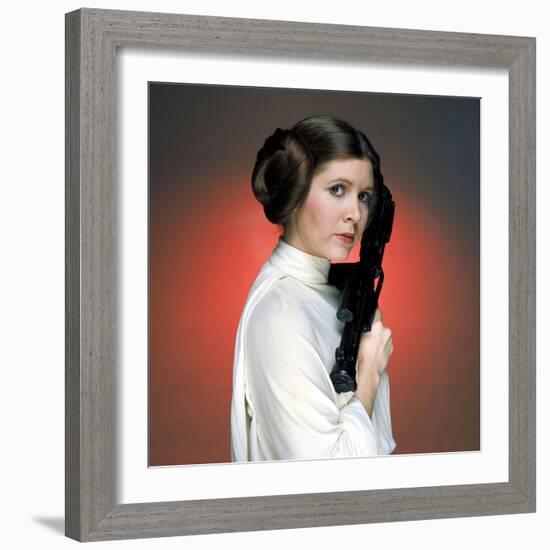 CARRIE FISHER. "Star Wars: Episode IV-A New Hope" [1977], directed by GEORGE LUCAS.-null-Framed Photographic Print