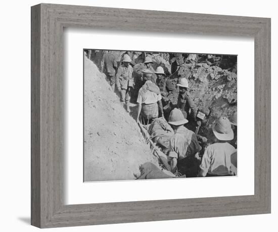 'Carrying wounded through the trenches', 1915-Unknown-Framed Photographic Print