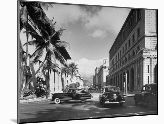 Cars Crossing an Intersection on a Downtown Honolulu Street with Mountains in the Background-null-Mounted Photographic Print