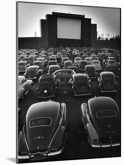 Cars Filling Lot at New Rancho Drive in Theater at Dusk Before the Start of the Feature Movie-Allan Grant-Mounted Photographic Print