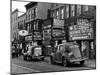 Cars Parked in Front of Four Navy Uniform Stores on Sand Street-Andreas Feininger-Mounted Photographic Print