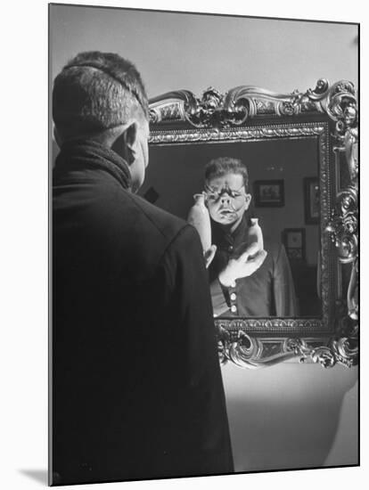 Cartoonist Charles Addams Experimenting with Scary Faces for His Cartoon, The Addams Family-Al Fenn-Mounted Premium Photographic Print