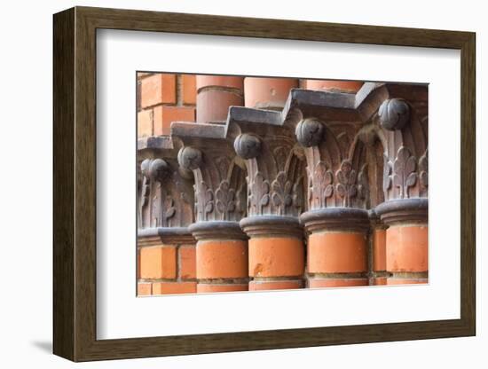 Carved red columns in the old town, Riga, Latvia-Keren Su-Framed Photographic Print