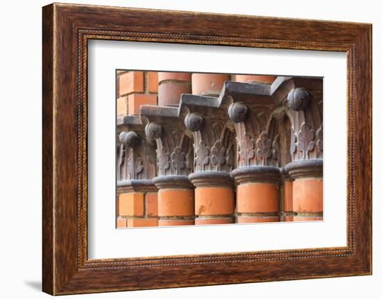 Carved red columns in the old town, Riga, Latvia-Keren Su-Framed Photographic Print