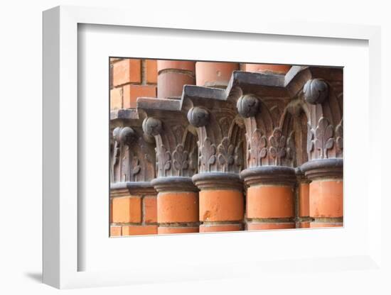 Carved red columns in the old town, Riga, Latvia-Keren Su-Framed Photographic Print