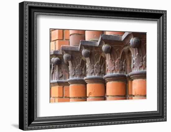 Carved red columns in the old town, Riga, Latvia-Keren Su-Framed Photographic Print