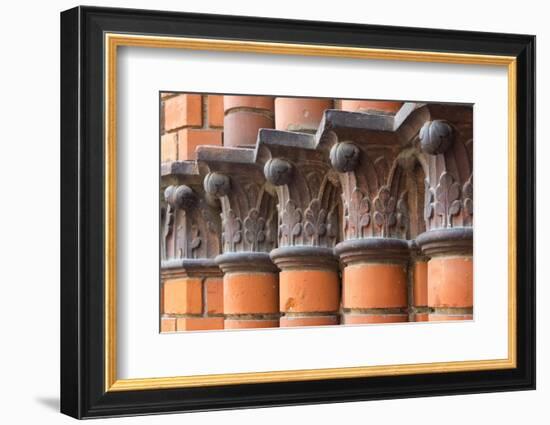 Carved red columns in the old town, Riga, Latvia-Keren Su-Framed Photographic Print