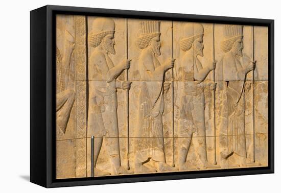 Carved relief of Royal Persian guard, Apadana Palace, Persepolis, UNESCO World Heritage Site, Iran,-James Strachan-Framed Premier Image Canvas
