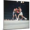 Cassius Clay, aka Muhammad Ali Throwing Famous "Phantom Punch"-George Silk-Mounted Premium Photographic Print