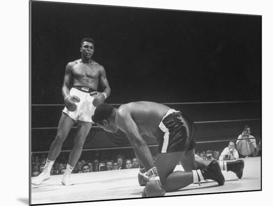 Cassius Clay Dancing Around Ring, Looking at Floyd Patterson, Whom He Has Just Knocked Down-Art Rickerby-Mounted Premium Photographic Print