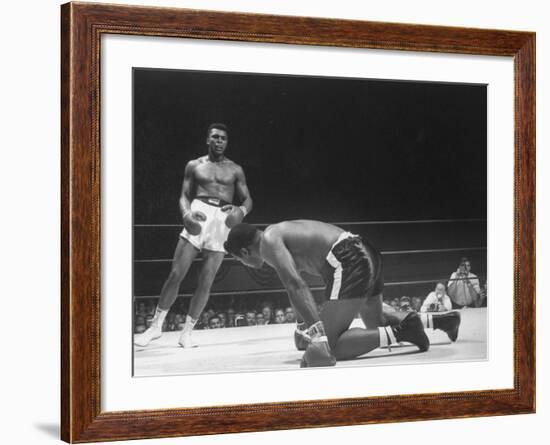 Cassius Clay Dancing Around Ring, Looking at Floyd Patterson, Whom He Has Just Knocked Down-Art Rickerby-Framed Premium Photographic Print