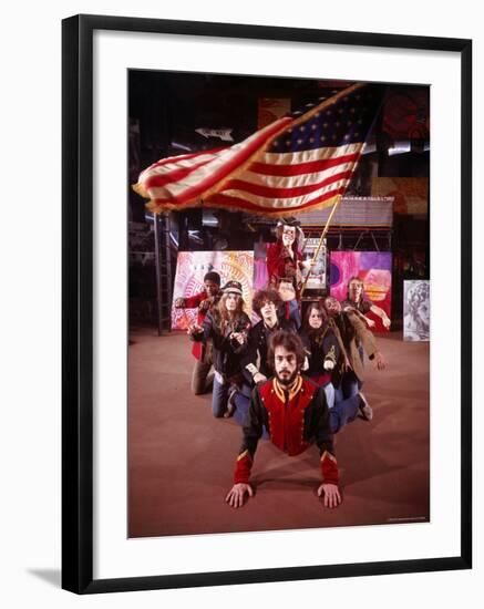 Cast of Theater Production of the Musical "Hair" under Large Waving American Flag-Ralph Morse-Framed Premium Photographic Print