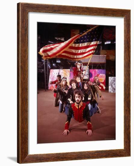 Cast of Theater Production of the Musical "Hair" under Large Waving American Flag-Ralph Morse-Framed Premium Photographic Print