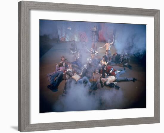 Cast Singing and Lolling About on Incense-Smoke-Filled Stage in Scene from Musical "Hair"-Ralph Morse-Framed Photographic Print