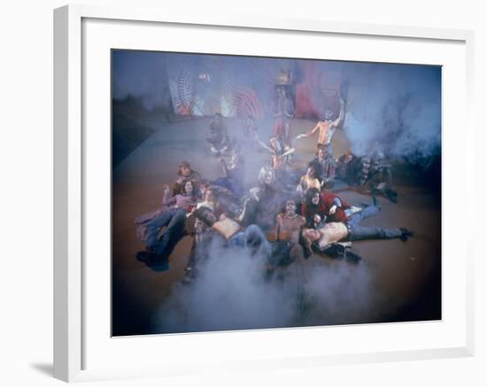 Cast Singing and Lolling About on Incense-Smoke-Filled Stage in Scene from Musical "Hair"-Ralph Morse-Framed Photographic Print