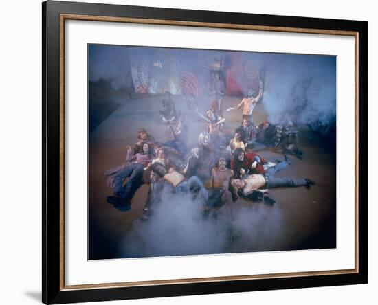 Cast Singing and Lolling About on Incense-Smoke-Filled Stage in Scene from Musical "Hair"-Ralph Morse-Framed Photographic Print
