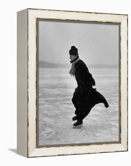 Catholic Priest Ice Skating. from Photo Essay Re Polish American Community-John Dominis-Framed Premier Image Canvas