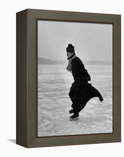 Catholic Priest Ice Skating. from Photo Essay Re Polish American Community-John Dominis-Framed Premier Image Canvas