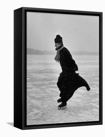 Catholic Priest Ice Skating. from Photo Essay Re Polish American Community-John Dominis-Framed Premier Image Canvas