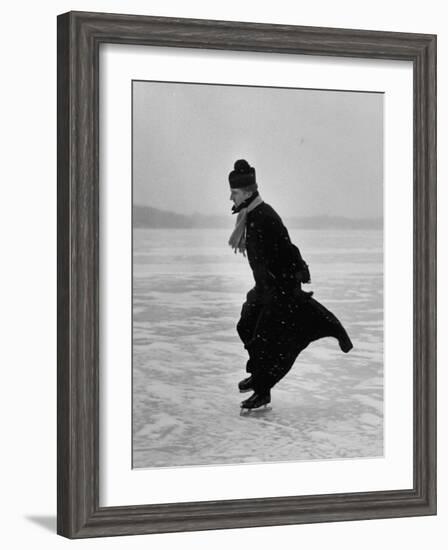 Catholic Priest Ice Skating. from Photo Essay Re Polish American Community-John Dominis-Framed Photographic Print