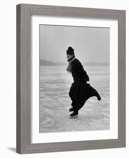 Catholic Priest Ice Skating. from Photo Essay Re Polish American Community-John Dominis-Framed Photographic Print