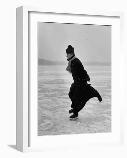 Catholic Priest Ice Skating. from Photo Essay Re Polish American Community-John Dominis-Framed Photographic Print
