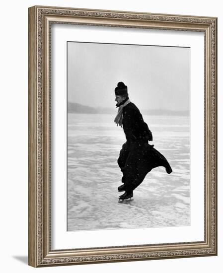 Catholic Priest Ice Skating-John Dominis-Framed Photographic Print