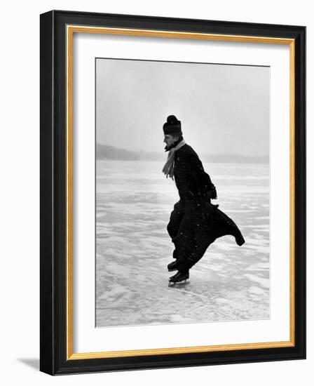 Catholic Priest Ice Skating-John Dominis-Framed Photographic Print