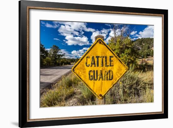 Cattle Guard Road sign outside of Ridgway, Colorado warns people of open range grazing-null-Framed Photographic Print