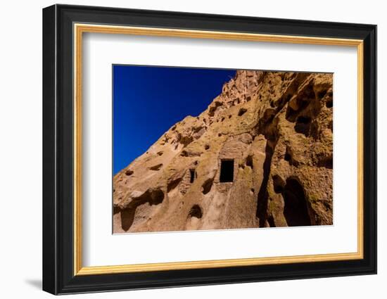 Cave dwellings on the Cliffside of Pueblo Indian Ruins in Bandelier National Monument, USA-Laura Grier-Framed Photographic Print