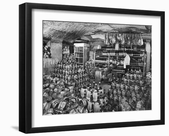 Cellarman at Giannino's Handing Bottle of Wine to Waiter for His Customers-Alfred Eisenstaedt-Framed Photographic Print