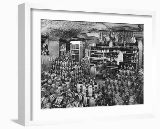Cellarman at Giannino's Handing Bottle of Wine to Waiter for His Customers-Alfred Eisenstaedt-Framed Photographic Print