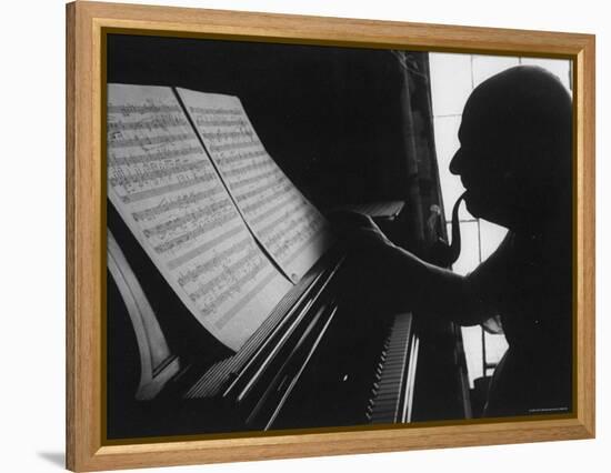 Cellist Pablo Casals at the Piano Studying a Musical Score and Smoking Pipe-Gjon Mili-Framed Premier Image Canvas