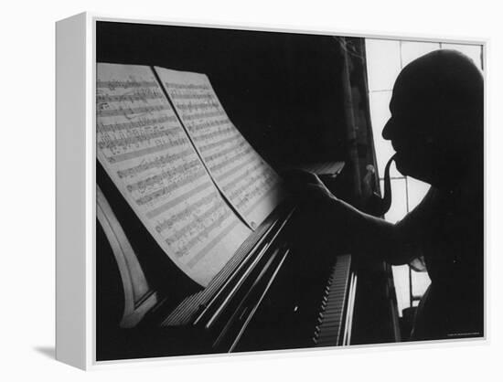 Cellist Pablo Casals at the Piano Studying a Musical Score and Smoking Pipe-Gjon Mili-Framed Premier Image Canvas
