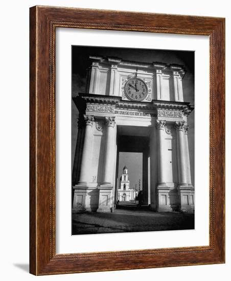 Cement Archway Featuring a Clock over the Entrance to the Grounds of the Greek Orthodox Church-Margaret Bourke-White-Framed Photographic Print