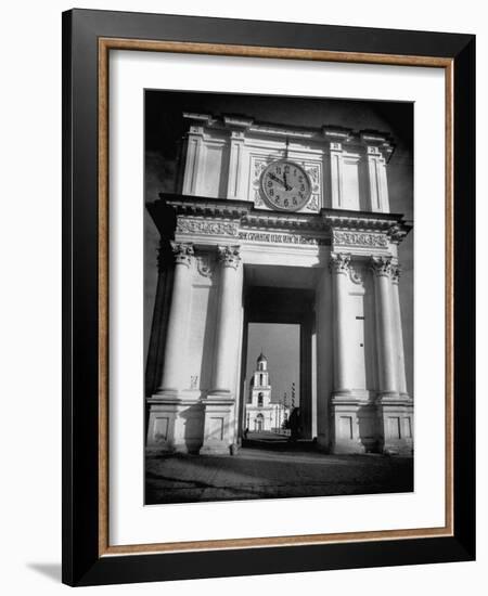 Cement Archway Featuring a Clock over the Entrance to the Grounds of the Greek Orthodox Church-Margaret Bourke-White-Framed Photographic Print