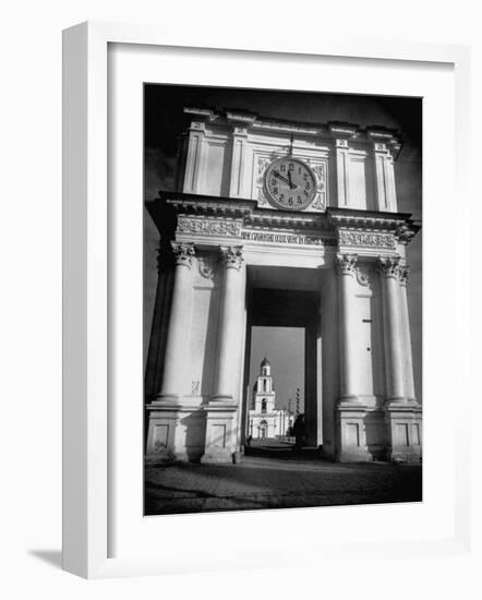 Cement Archway Featuring a Clock over the Entrance to the Grounds of the Greek Orthodox Church-Margaret Bourke-White-Framed Photographic Print