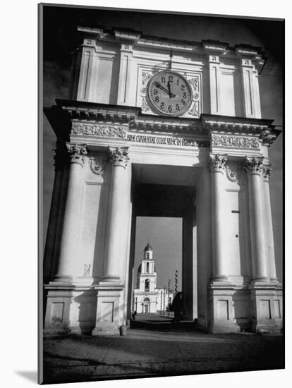 Cement Archway Featuring a Clock over the Entrance to the Grounds of the Greek Orthodox Church-Margaret Bourke-White-Mounted Photographic Print