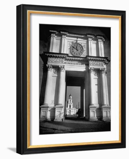 Cement Archway Featuring a Clock over the Entrance to the Grounds of the Greek Orthodox Church-Margaret Bourke-White-Framed Photographic Print