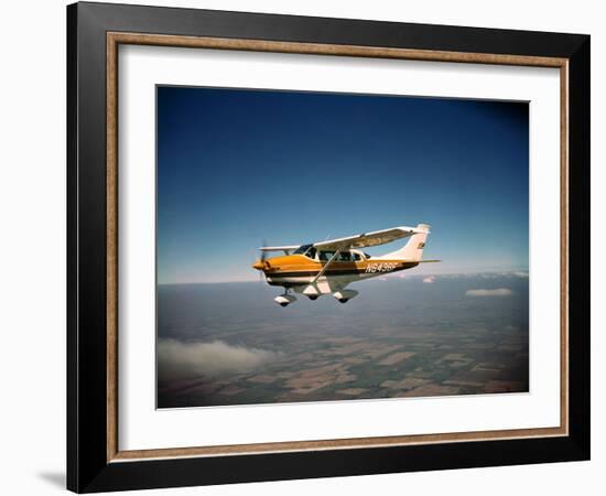Cessna Superlobe Flying-null-Framed Photographic Print