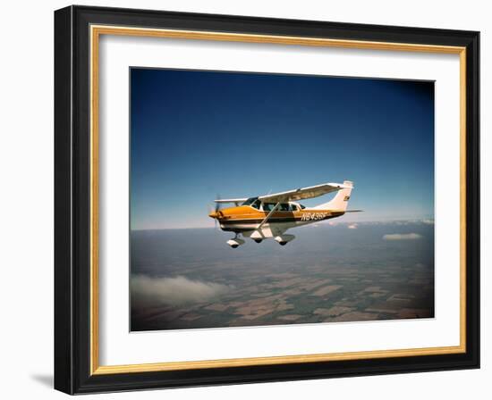 Cessna Superlobe Flying-null-Framed Photographic Print